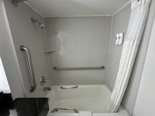a small bathroom with a shower and a toilet at Comfort Inn Conyers in Conyers