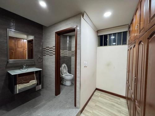 a bathroom with a toilet and a sink at casa la Villa paipa in Paipa