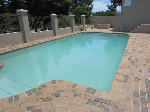 The swimming pool at or close to Serengeti Self Catering Units