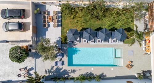 an overhead view of a pool at a resort at Hypnosis Beachside Villa with Private Heated Pool in Georgioupolis