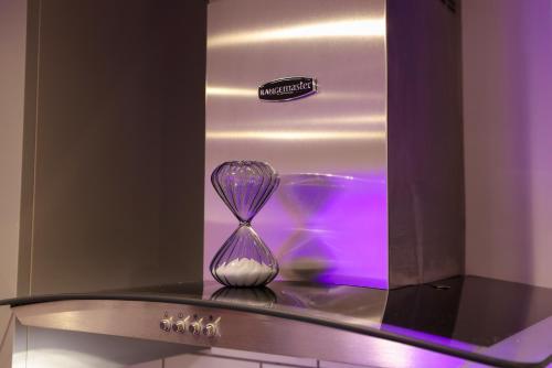 a glass vase sitting on top of a counter at Stylish 1 Bed Apartment in Bicester Town Centre in Bicester