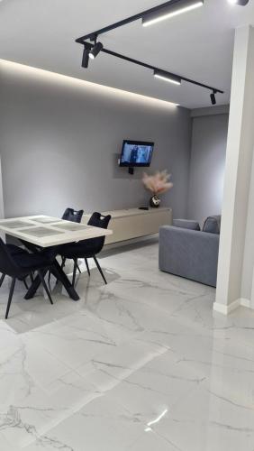 a living room with a table and a couch at Air-Moldova N1 in Chişinău