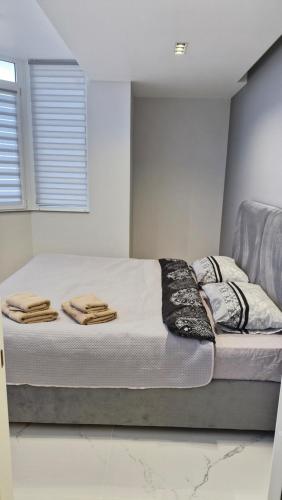 a bed in a room with towels on it at Air-Moldova N1 in Chişinău
