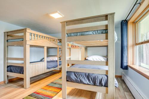 two bunk beds in a tiny house at Lakefront Home with Fire Pit in Eagle River in Eagle River