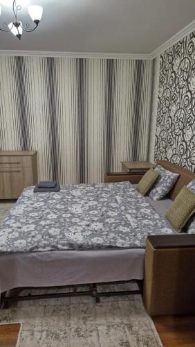 a bedroom with a large bed in a room at Air-Moldova N1 in Chişinău
