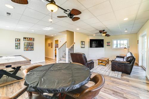 a living room with a ping pong table and chairs at Kentucky Lake Home with Shared Dock! in Gilbertsville