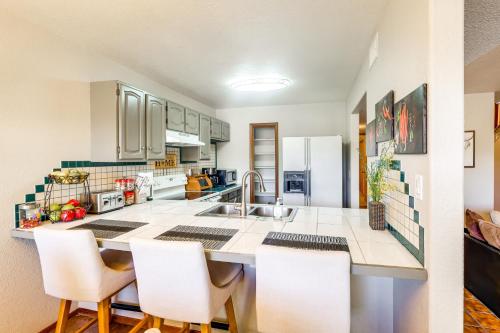 a kitchen with a sink and a counter top at Lakefront Unit with Dock in Carlsbad! in Carlsbad