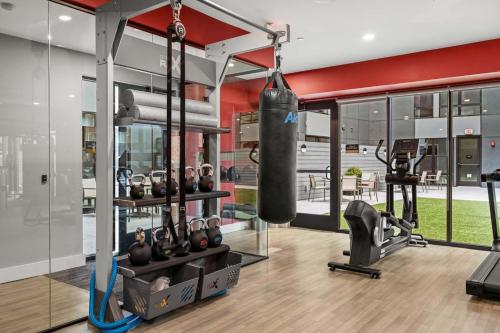 a gym with a punching bag and weights in a room at Luxury Furnished Apartments by Hyatus Downtown at Yale in New Haven