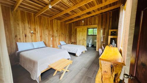 Postel nebo postele na pokoji v ubytování El Toucanet Lodge & Restaurante