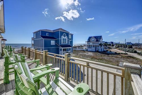 a deck with chairs and a house on the beach at Ocean View - Just Steps from Oceanfront - 2 Full Width Sun Decks - 3 King Suites in North Topsail Beach