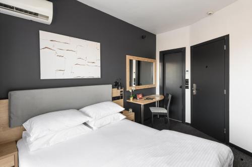 Una cama o camas en una habitación de Park Hotel