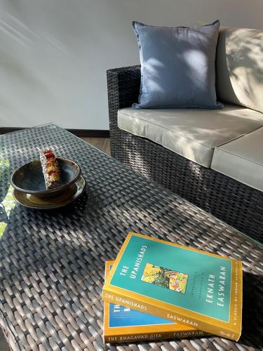 a book on a table with a slice of cake on it at Nereus in Puerto Jiménez