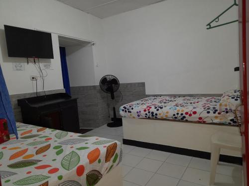 Llit o llits en una habitació de Posada San Carlos
