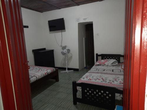 Llit o llits en una habitació de Posada San Carlos