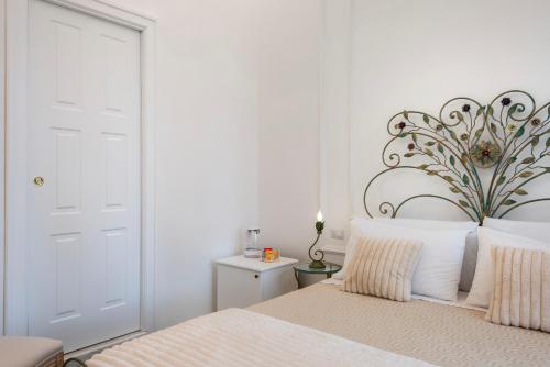 Ένα ή περισσότερα κρεβάτια σε δωμάτιο στο Residenza Borbonica