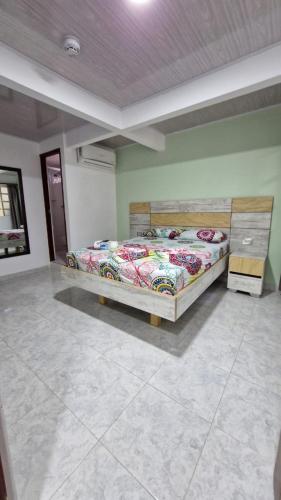 a bedroom with two beds in a room at Hotel ocaso real in Villavicencio