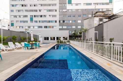 a swimming pool on the roof of a building at Moov 2415 Studio Mooca in Sao Paulo