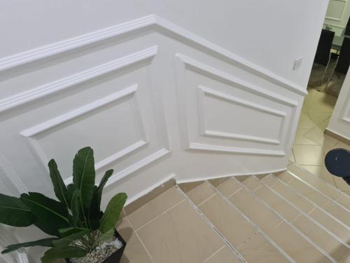 a white door with a potted plant in a room at Sofitel Executive 3 bedrooms own compound in Kisumu