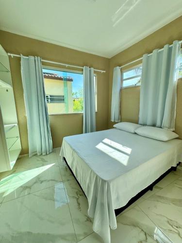 Ένα ή περισσότερα κρεβάτια σε δωμάτιο στο Casa flecheiras aconchego