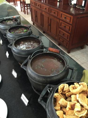 a group of pots and pans with food in them at Hotel Fazenda Santa Maria in Serra Negra