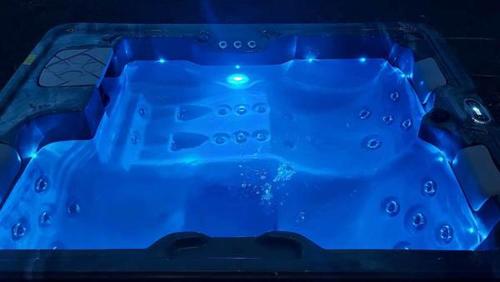 a blue plastic tub with a controller in it at Love Room Les sens'même in Bouloupari
