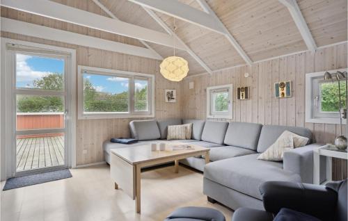 a living room with a couch and a table at Lovely Home In Hemmet With Kitchen in Hemmet