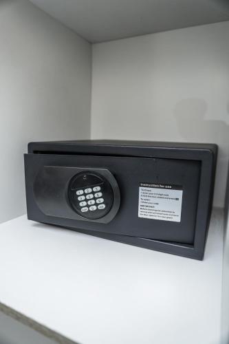 a microwave oven sitting on top of a counter at Q's Boutique Stay in Standerton