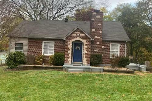 a red brick house with a blue door at House, Near Downtown with Fenced Back Yard!!!! in Knoxville