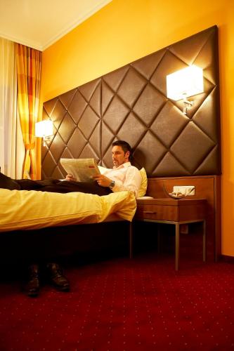 Postel nebo postele na pokoji v ubytování Villa Ceconi by Das Grüne Hotel zur Post - 100% BIO
