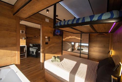 a bedroom with a bed in a room at SnowGranada Love Snow Jacuzzi in Sierra Nevada