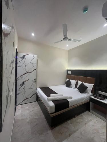 Hotel Powai Palaceにあるベッド