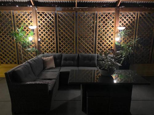 a living room with a couch and a table at Family Home Away From Home in Rockingham