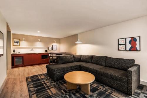 a living room with a couch and a table at Holiday Inn Missoula Downtown by IHG in Missoula