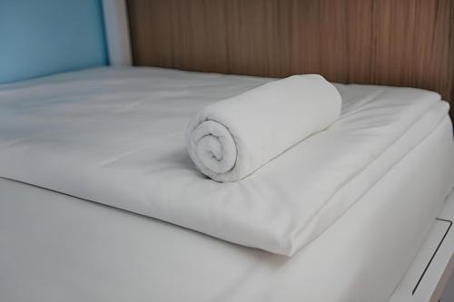 Postel nebo postele na pokoji v ubytování Ease Hostel