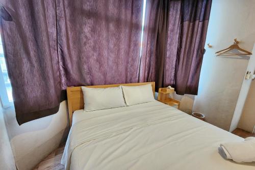 Postel nebo postele na pokoji v ubytování Ease Hostel