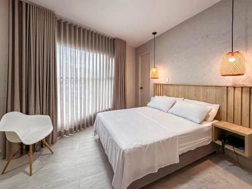 Uma cama ou camas num quarto em Hotel Amor de Mae