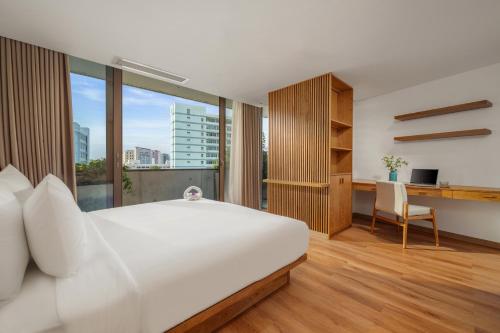 Vernal Hotel & Apartment Da Nangにあるベッド