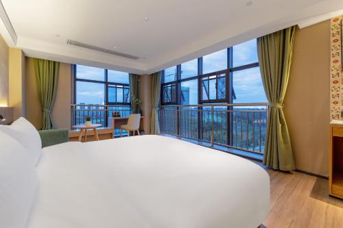Katil atau katil-katil dalam bilik di Anshe S Hotel