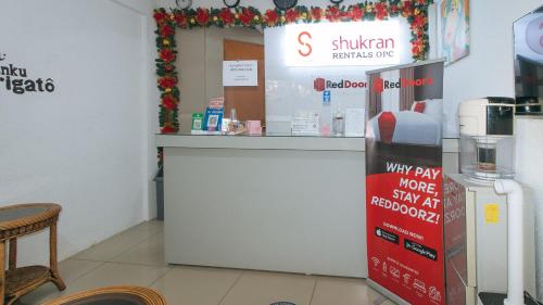 a store with a cash counter in a store at RedDoorz Plus near Tambo Paranaque in Manila