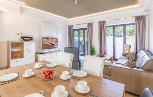 a kitchen and living room with a table and chairs at Diamond in Binz