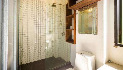 a bathroom with a shower and a toilet at Belakang Kong Heng Ipoh Hotel in Ipoh