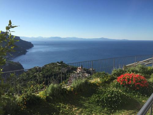 a view of the ocean from a garden at La Casa di Vania in Ravello