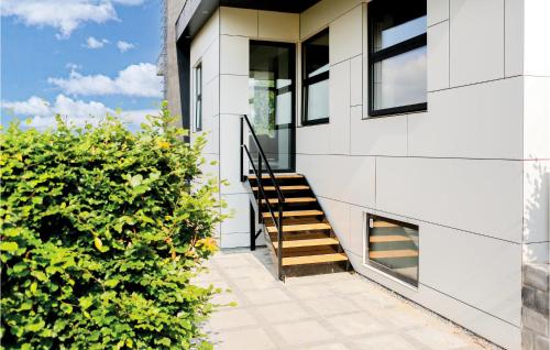 a house with a staircase on the side of it at Three-Bedroom Holiday Home In Borkop in Børkop