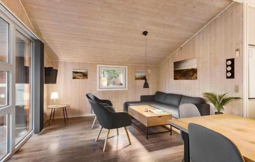 a living room with a couch and a table at Two-Bedroom Holiday Home In Toftlund in Toftlund