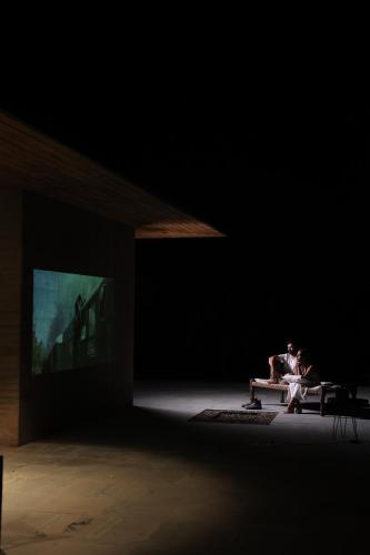 two people sitting on a bench in a dark room at Walden in Nohan