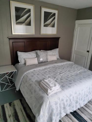 a bedroom with a bed with two towels on it at Darma Apartments in Providence