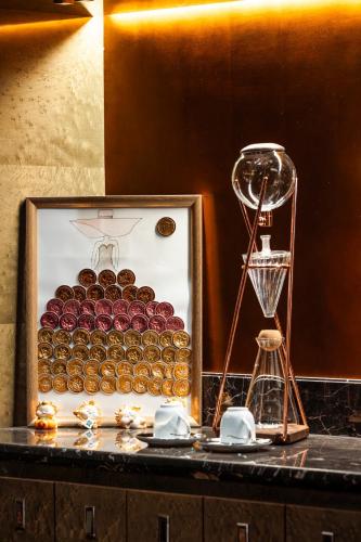 a counter top with a clock and a scale and a clock at Fairmont Chengdu in Chengdu
