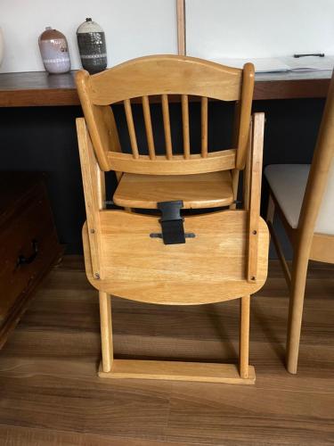 a wooden chair sitting in front of a desk at ジャスミン in Beppu