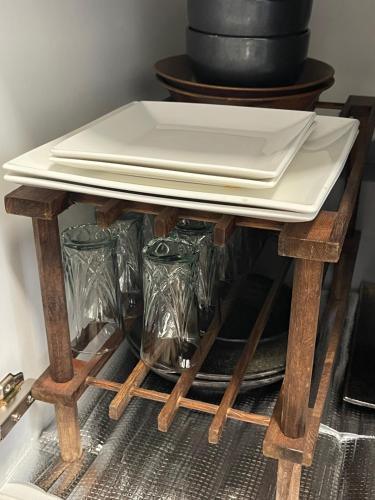 a table with a white plate on top of it at ジャスミン in Beppu