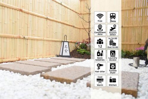 a pile of snow next to a fence with a sign at Osaka Shinsaibashi Dotonbori Courtyard Villa in Osaka